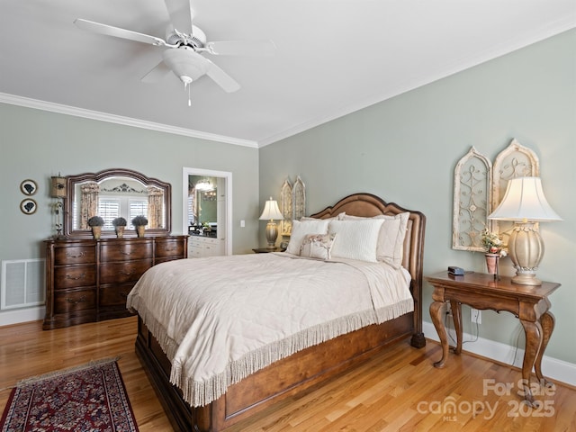 5572 Yorke St NW, Concord, NC 28027 - bedroom with crown molding, wood finished floors, and ceiling fan