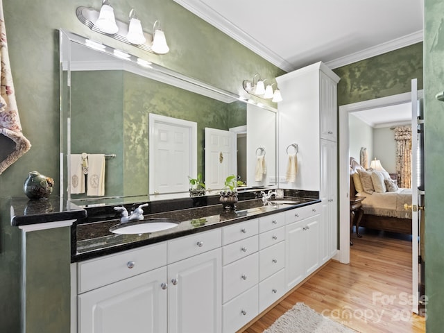 5572 Yorke St NW, Concord, NC 28027 - ensuite bathroom with double vanity, crown molding, and wood finished floors