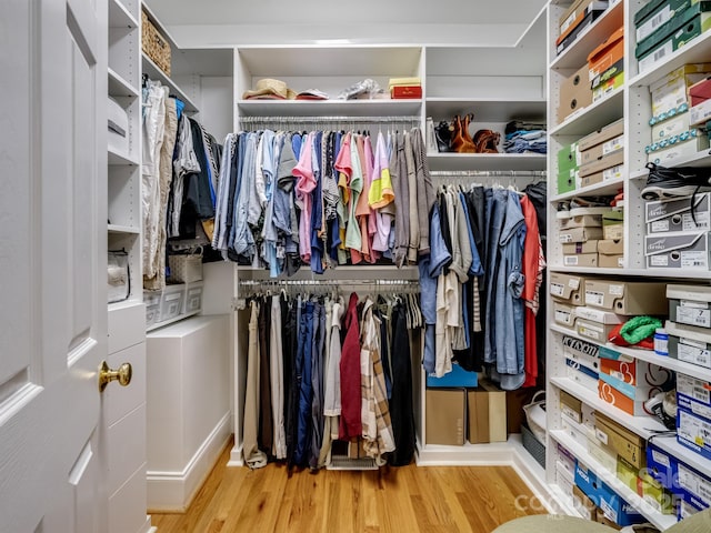 5572 Yorke St NW, Concord, NC 28027 - spacious closet with wood finished floors