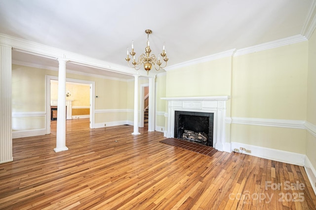 1010 College Ave SW, Lenoir, NC 28645 - unfurnished living room with light wood-type flooring, a chandelier, a fireplace with flush hearth, and ornamental molding