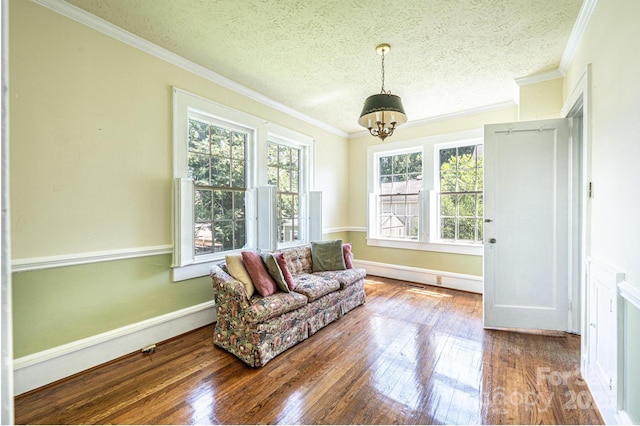 1010 College Ave SW, Lenoir, NC 28645 - living area with a textured ceiling, hardwood / wood-style floors, ornamental molding, and a chandelier