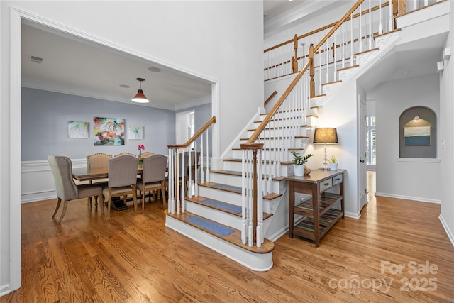 6800 Augustine Way, Charlotte, NC 28270 - stairs with crown molding, wood finished floors, and a high ceiling