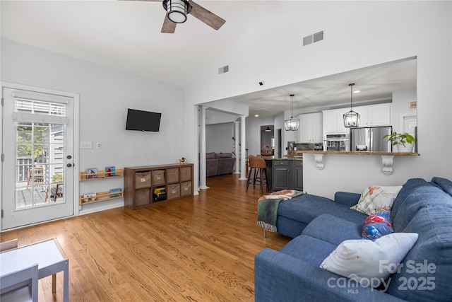 6800 Augustine Way, Charlotte, NC 28270 - living room featuring ceiling fan, light wood finished floors, and high vaulted ceiling