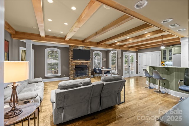 6800 Augustine Way, Charlotte, NC 28270 - living room with beam ceiling, a fireplace, wood finished floors, decorative columns, and recessed lighting