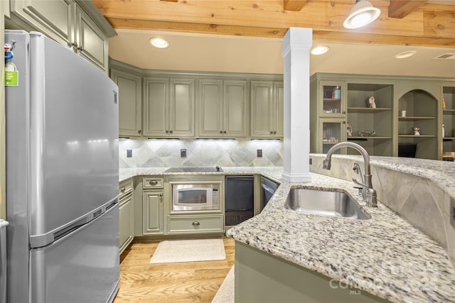 6800 Augustine Way, Charlotte, NC 28270 - kitchen featuring freestanding refrigerator, green cabinets, white microwave, light wood-style flooring, and recessed lighting