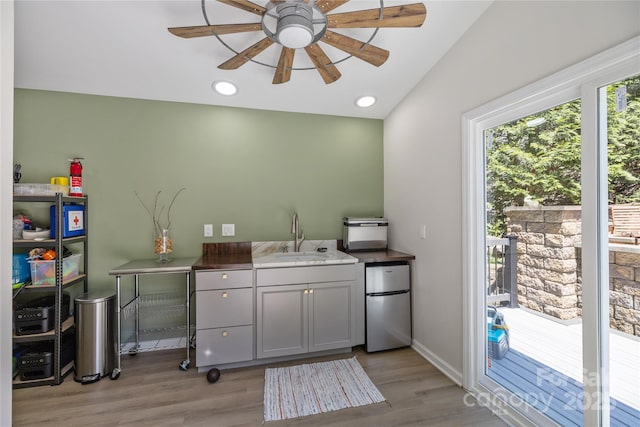 6800 Augustine Way, Charlotte, NC 28270 - kitchen with freestanding refrigerator, a ceiling fan, light wood-style flooring, and vaulted ceiling