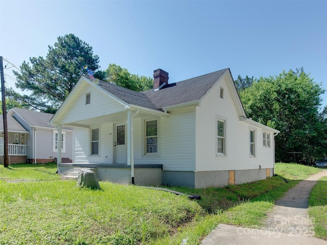 2414 Lane St, Kannapolis, NC 28083 - view of front of property with covered porch, a chimney, and a front yard
