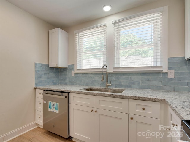 2414 Lane St, Kannapolis, NC 28083 - kitchen featuring dishwasher, white cabinetry, tasteful backsplash, and light wood-style floors