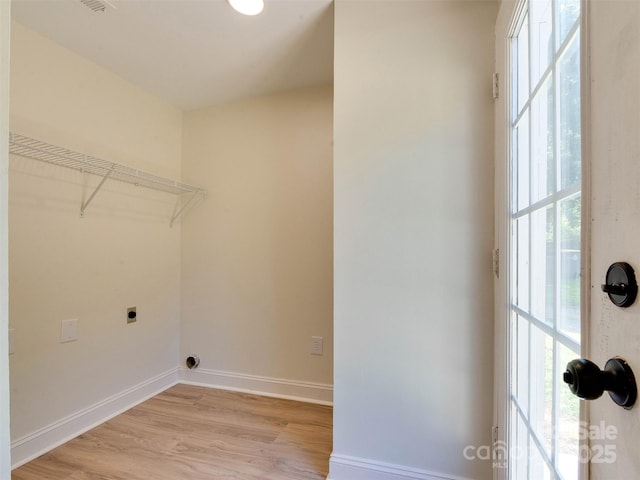 2414 Lane St, Kannapolis, NC 28083 - laundry area with hookup for an electric dryer, plenty of natural light, and light wood-type flooring
