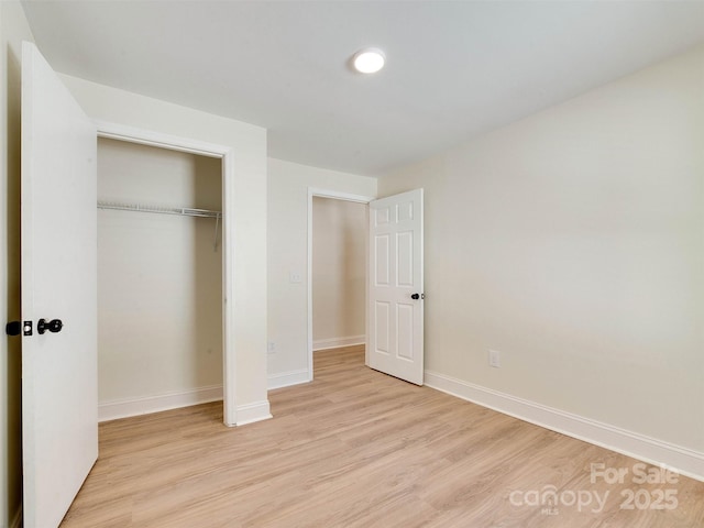 2414 Lane St, Kannapolis, NC 28083 - unfurnished bedroom featuring light wood-style floors and a closet