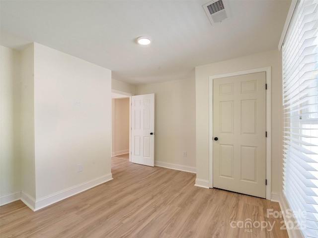 2414 Lane St, Kannapolis, NC 28083 - unfurnished bedroom featuring light wood-style floors and baseboards