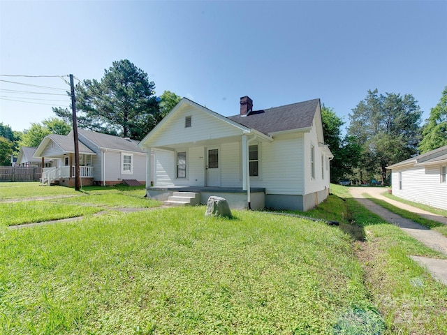 2414 Lane St, Kannapolis, NC 28083 - bungalow-style house featuring a porch, a front lawn, and a chimney