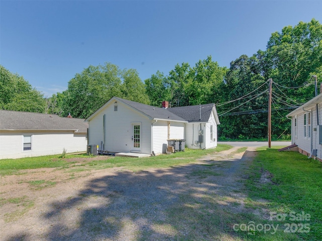 2414 Lane St, Kannapolis, NC 28083 - view of side of home with a chimney and a cooling unit