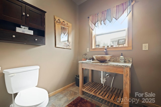 442 Blantyre Church Rd, Horse Shoe, NC 28742 - bathroom featuring stone tile floors and vanity