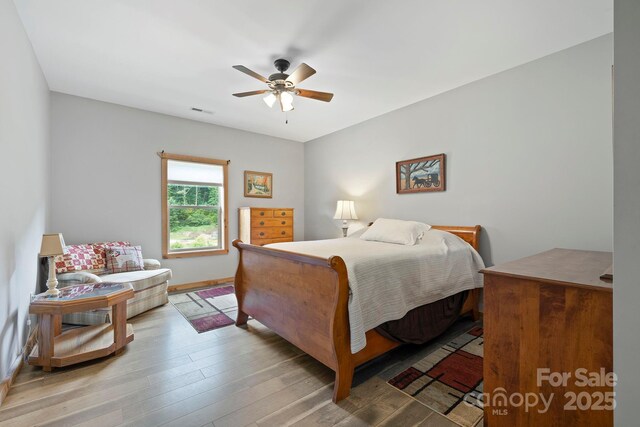 442 Blantyre Church Rd, Horse Shoe, NC 28742 - bedroom featuring wood finished floors and a ceiling fan