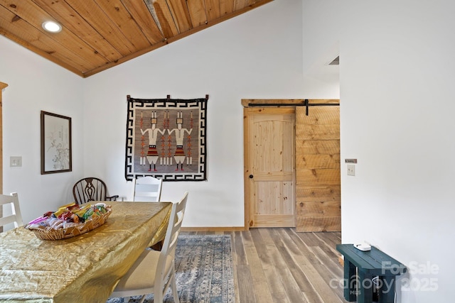 442 Blantyre Church Rd, Horse Shoe, NC 28742 - dining area with lofted ceiling, wood finished floors, a barn door, wood ceiling, and recessed lighting