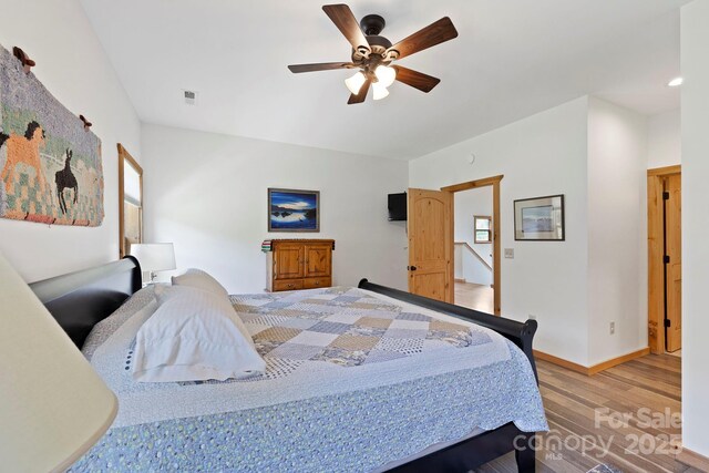 442 Blantyre Church Rd, Horse Shoe, NC 28742 - bedroom with wood finished floors and ceiling fan