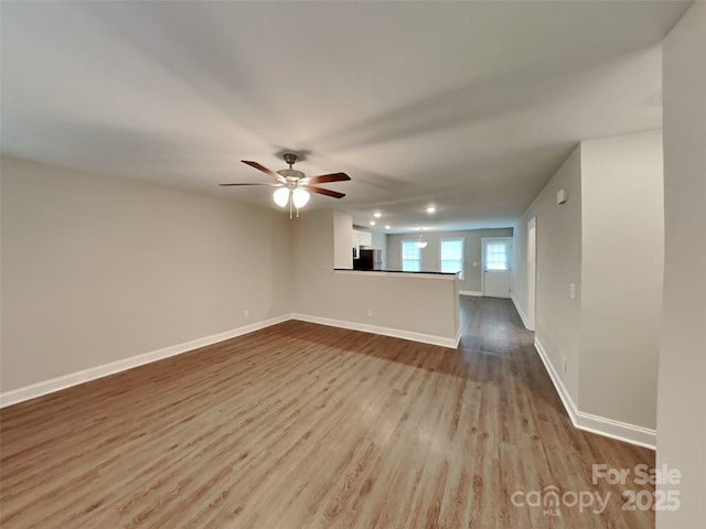 115 Dove Ave SW, Concord, NC 28025 - unfurnished living room with dark wood-style flooring, a ceiling fan, and recessed lighting