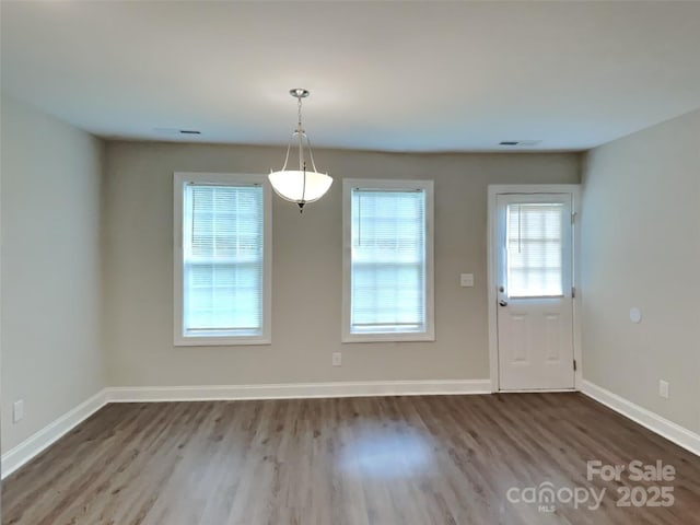 115 Dove Ave SW, Concord, NC 28025 - unfurnished dining area featuring wood finished floors and baseboards
