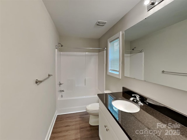 115 Dove Ave SW, Concord, NC 28025 - bathroom with vanity, shower / washtub combination, and wood finished floors