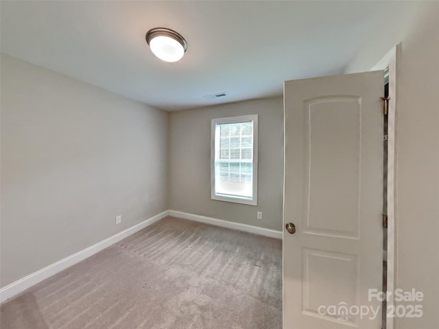 115 Dove Ave SW, Concord, NC 28025 - carpeted spare room with baseboards