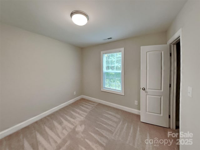 115 Dove Ave SW, Concord, NC 28025 - empty room featuring baseboards and light carpet