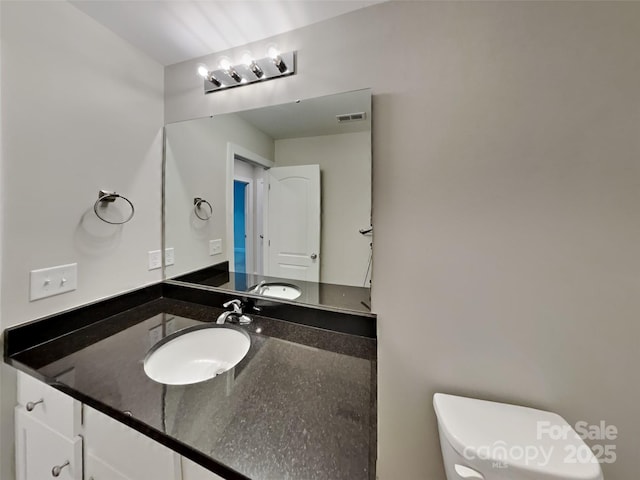115 Dove Ave SW, Concord, NC 28025 - bathroom featuring toilet and vanity