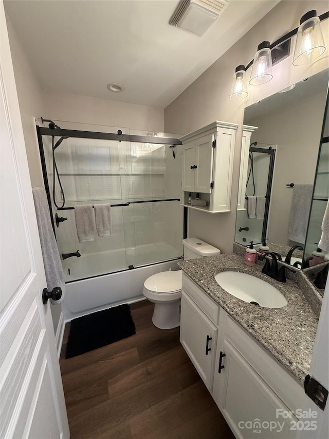 1013 Park W Dr Unit 5, Charlotte, NC 28209 - bathroom with wood finished floors, vanity, and shower / bath combination with glass door