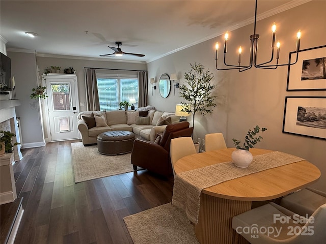 1013 Park W Dr Unit 5, Charlotte, NC 28209 - living room featuring a chandelier, dark wood-type flooring, a ceiling fan, ornamental molding, and a fireplace