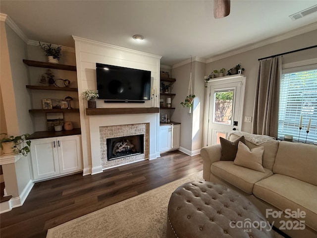 1013 Park W Dr Unit 5, Charlotte, NC 28209 - living room featuring dark wood-style flooring, plenty of natural light, a tile fireplace, and ornamental molding