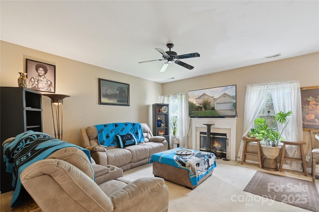 11440 Lamoille Ln, Charlotte, NC 28278 - living room with a ceiling fan, carpet, and a glass covered fireplace
