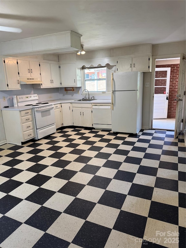 1239 8th St NE, Hickory, NC 28601 - kitchen featuring white appliances, under cabinet range hood, light countertops, light floors, and white cabinetry