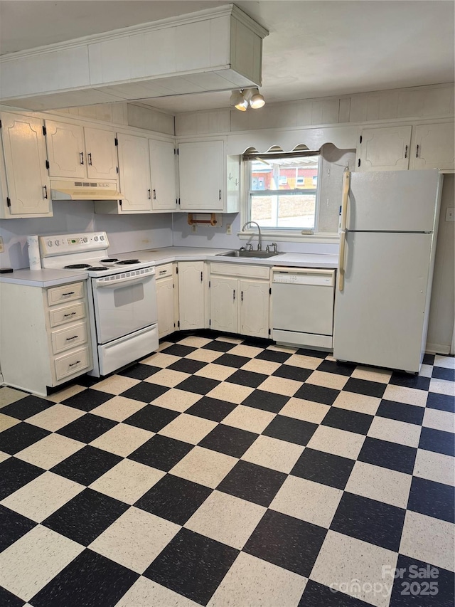 1239 8th St NE, Hickory, NC 28601 - kitchen featuring white appliances, under cabinet range hood, light countertops, and white cabinetry