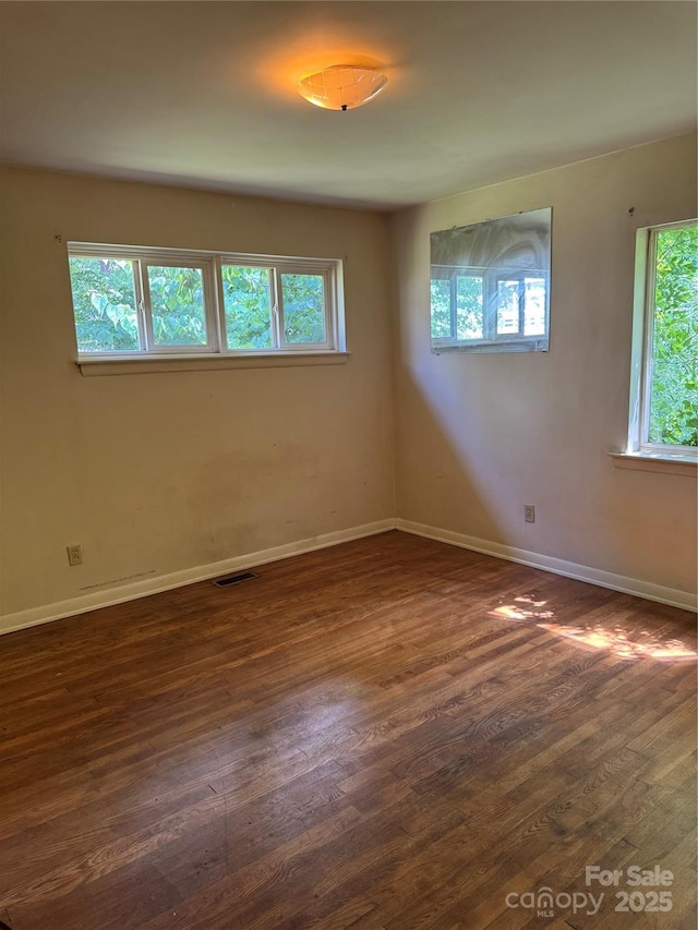 1239 8th St NE, Hickory, NC 28601 - unfurnished room with dark wood-style flooring