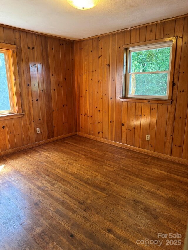 1239 8th St NE, Hickory, NC 28601 - unfurnished room featuring wood finished floors and wooden walls