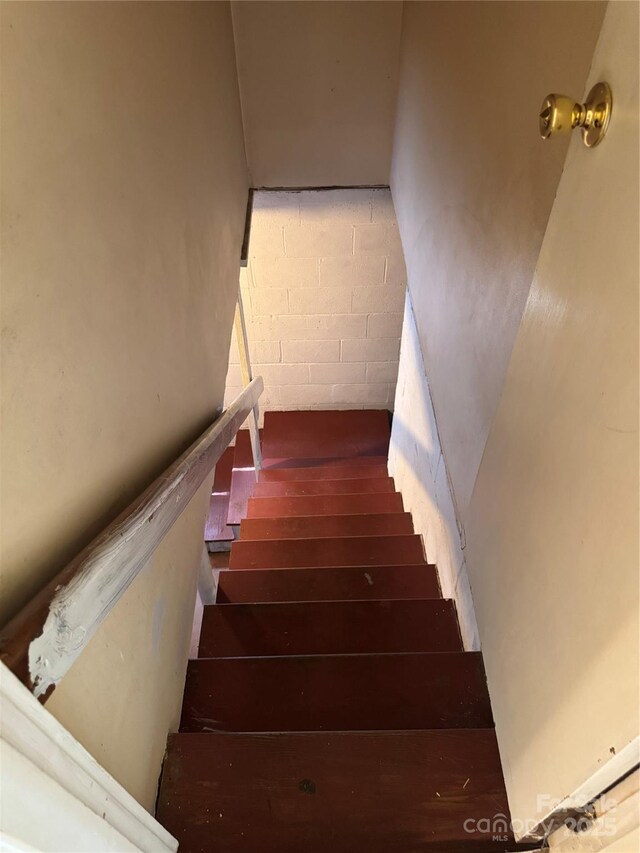 1239 8th St NE, Hickory, NC 28601 - stairway featuring concrete block wall