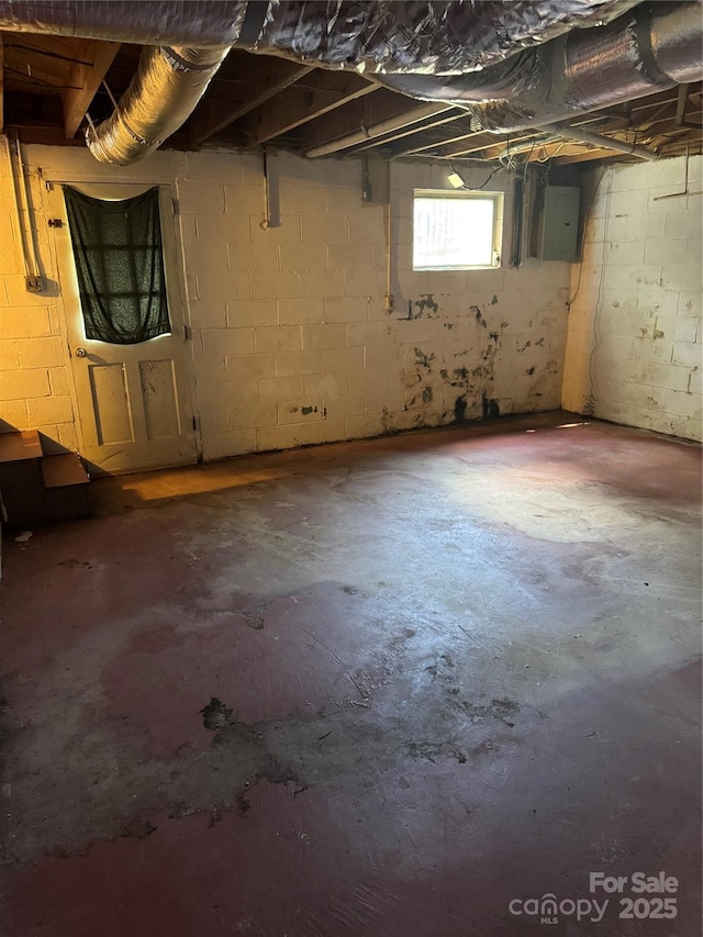 1239 8th St NE, Hickory, NC 28601 - basement with concrete block wall and electric panel