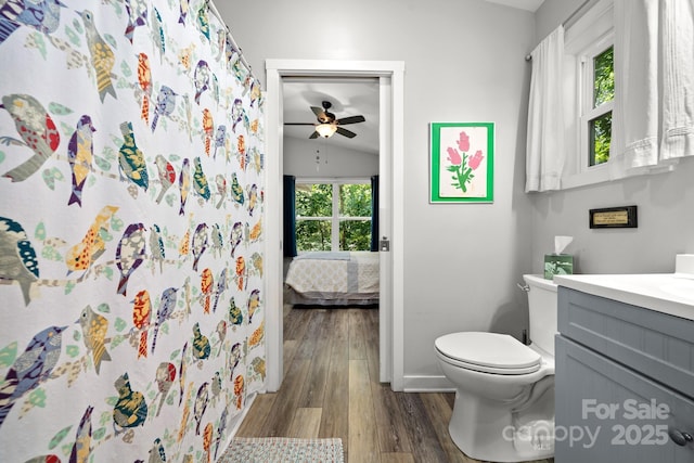 211 Summer St, Swannanoa, NC 28778 - bathroom with vanity, wood finished floors, a ceiling fan, connected bathroom, and a shower with curtain