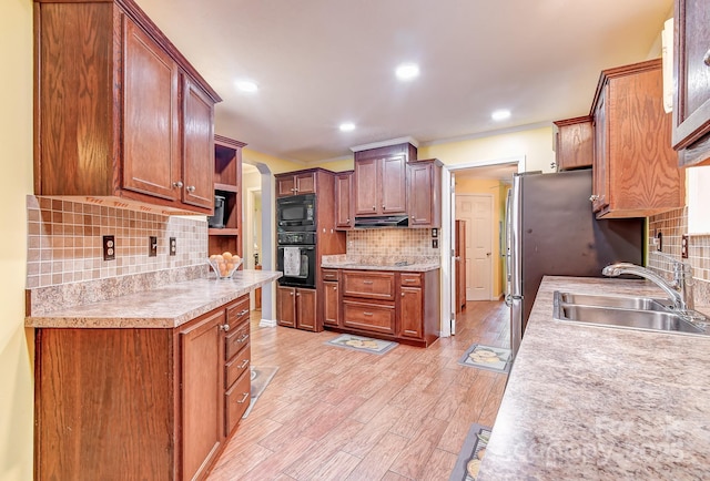 20 Jessica Ln, Barnardsville, NC 28709 - kitchen with black appliances, decorative backsplash, under cabinet range hood, light countertops, and recessed lighting