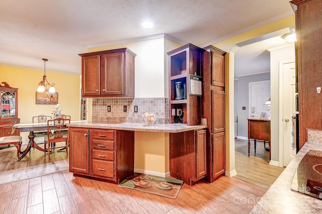 20 Jessica Ln, Barnardsville, NC 28709 - kitchen with ornamental molding, decorative backsplash, light wood-style floors, pendant lighting, and a chandelier