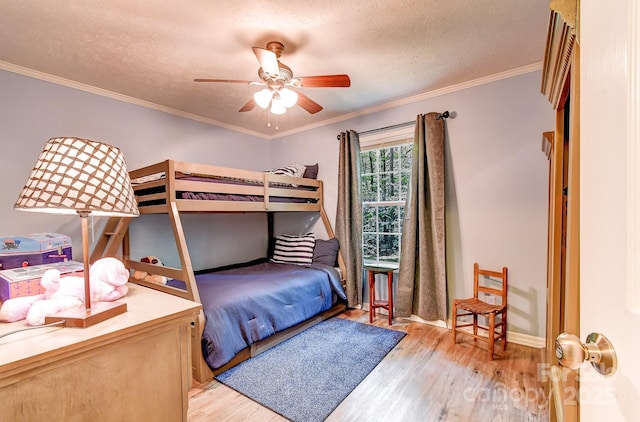 20 Jessica Ln, Barnardsville, NC 28709 - bedroom with wood finished floors, a textured ceiling, a ceiling fan, and ornamental molding