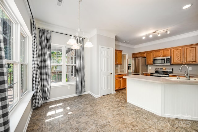 7731 Sedgebrook Dr E, Stanley, NC 28164 - kitchen featuring appliances with stainless steel finishes, a chandelier, ornamental molding, brown cabinets, and light countertops