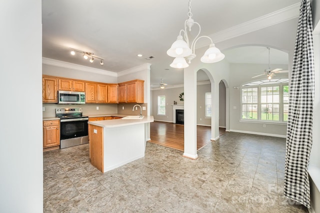 7731 Sedgebrook Dr E, Stanley, NC 28164 - kitchen featuring stainless steel appliances, a ceiling fan, arched walkways, ornamental molding, and open floor plan