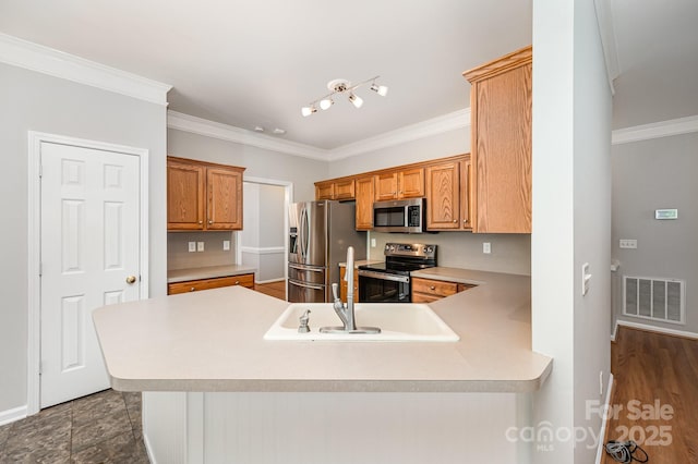 7731 Sedgebrook Dr E, Stanley, NC 28164 - kitchen with stainless steel appliances, light countertops, crown molding, a peninsula, and brown cabinetry