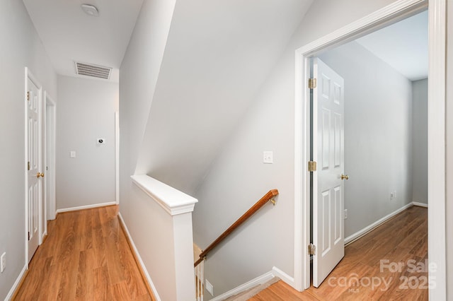7731 Sedgebrook Dr E, Stanley, NC 28164 - corridor with an upstairs landing and light wood finished floors