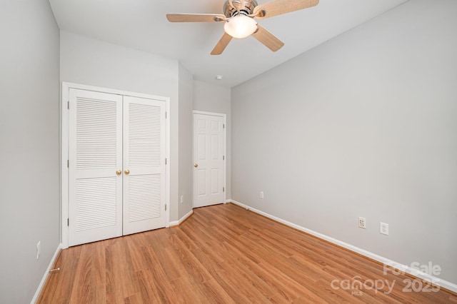 7731 Sedgebrook Dr E, Stanley, NC 28164 - unfurnished bedroom with light wood-style flooring, a closet, and a ceiling fan