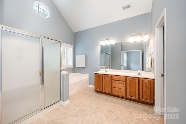 7731 Sedgebrook Dr E, Stanley, NC 28164 - bathroom with a shower stall, a bath, double vanity, high vaulted ceiling, and tile patterned flooring