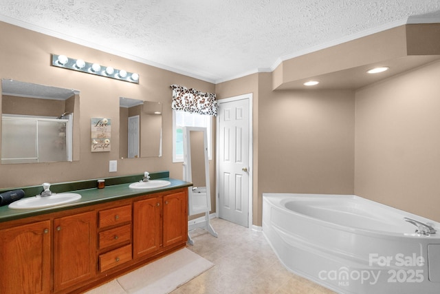 5701 Lockhart Rd, Kershaw, SC 29067 - bathroom with a garden tub, double vanity, crown molding, and a textured ceiling