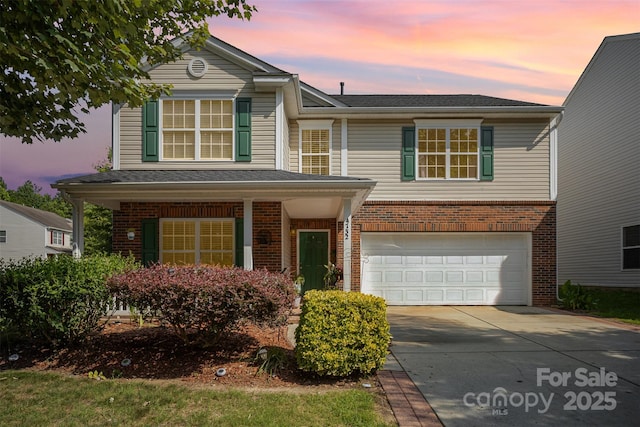4732 Meadowfield Rd Unit L35, Charlotte, NC 28215 - traditional home with brick siding, an attached garage, and concrete driveway