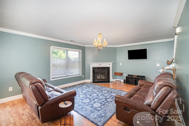 4732 Meadowfield Rd Unit L35, Charlotte, NC 28215 - living area featuring wood finished floors, crown molding, a chandelier, and a glass covered fireplace